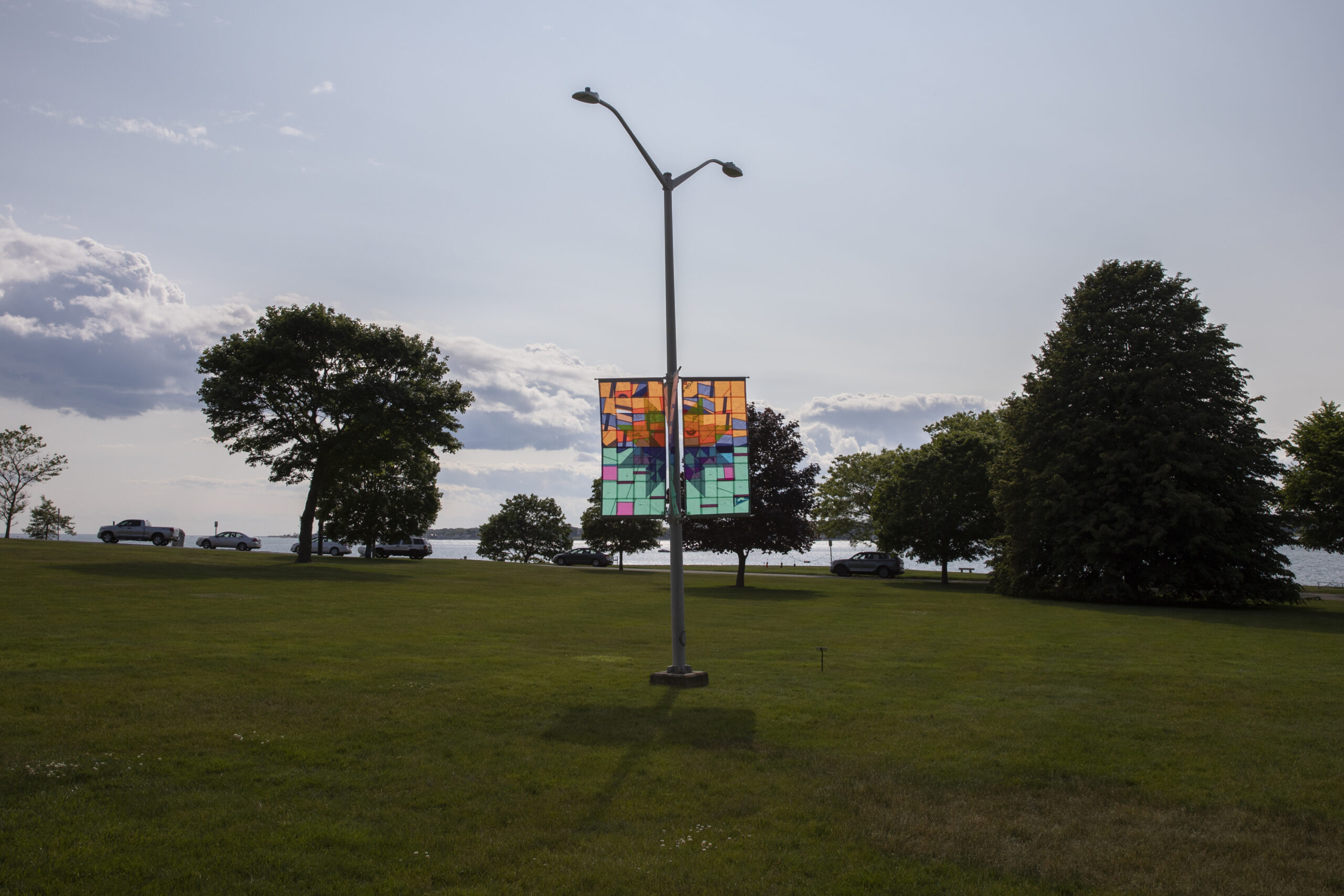 Cover Me with the Sea, 2023, quilted windsurf sails, 4 banners each 3’x6’, installation variable